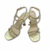 Sandalias doradas con cordones brillos y tacón de copa de Exé.