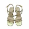 Sandalias doradas con cordones brillos y tacón de copa de Exé.